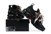 Nike Air Max Plus sneakers displayed with a shoe box whose label shows size 8.5 and a second size marking of 10.