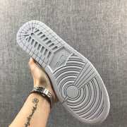 Underside view showing the white rubber outsole and circular traction pattern.