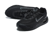 Pair of black Nike Air Max sneakers shown at an angled top view.