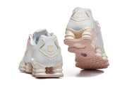 Rear views and outsole of Nike Shox TL sneakers.