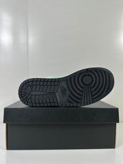 Outsole view showing the black patterned rubber sole of the sneaker.