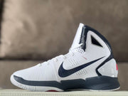 Side profile showing the Swoosh and sculpted panels of a white basketball shoe
