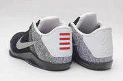 Rear views of the black and grey shoes with white heel panels