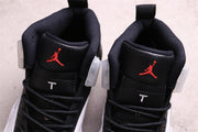 Close-up of the tongues showing red Jumpman logos and white T details.