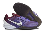 Side and outsole view of purple basketball shoes with white Swooshes and dark tread