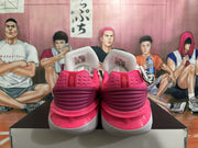Rear view of magenta Nike basketball shoes with gray soles