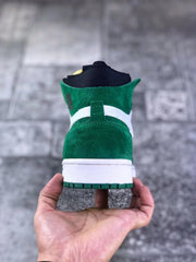 Rear view showing the green heel, white heel band, and green outsole.