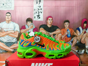 Side view showing the orange, green, and blue upper and visible Air units
