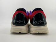 Rear view of the pair showing black heel panels and red collars