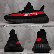 Collage showing side, front, and rear views of the black and red sneakers with Supreme lettering.