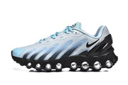 Side view of a light blue Nike Air Max DN sneaker with black podded sole.