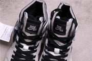 Top view showing black laces, padded collars, and Zoom Air tongue labels.