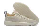 Beige low-top Nike Book 1 shoe with light Swoosh and cream outsole