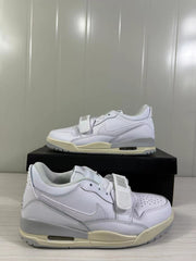 Close side view showing the perforated toe, forefoot strap, layered side panel, and padded collar.