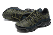 Close view of patterned olive upper, laces, and black cushioning sole