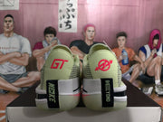 Rear view of the sneakers showing GT heel branding, black heel straps, and layered white midsoles.