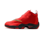 Red and black Nike Payton basketball sneaker with yellow detailing and red outsole accents.