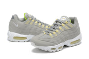 Pair of gray Nike Air Max 95 sneakers shown at side and three-quarter angles.