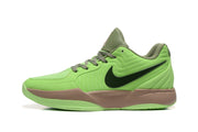 Side profile of a bright green Nike basketball shoe with a dark Swoosh and tan midsole.