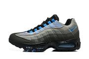 Side view of a Nike Air Max 95 TT sneaker in grey, black and blue.
