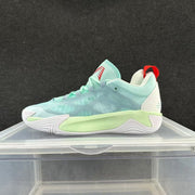 Mint green and pale aqua low-top basketball shoe with a white sole