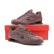Dark purple Nike Shox Z R2 sneakers displayed on a red shoe box