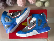 Pair photographed from above with blue uppers, gray panels, and white midsoles visible.
