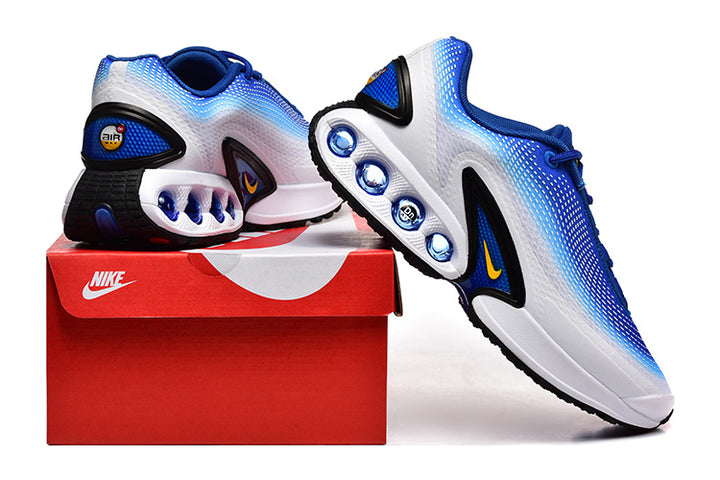 Blue and white Nike sneakers displayed beside a red shoe box