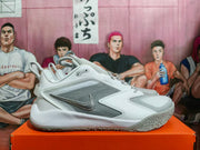 Side profile of a white and silver Nike basketball shoe
