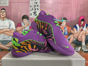 Angled display of purple Nike basketball sneakers showing the patterned side panels, green laces, and textured purple outsoles.