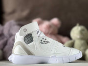Opposite side view showing the white high-top sneaker, perforated ankle panel, strap, and textured outsole.