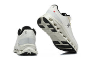 White On Cloudmonster 3 sneakers showing the heel and outsole.