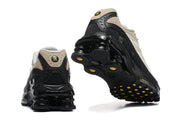Rear and outsole views of Nike Shox Ride 2 sneakers with sculpted black heel columns.