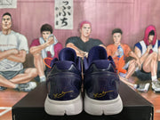 Rear view of the Nike basketball sneakers showing dark navy heel panels, padded collars, and white midsoles.