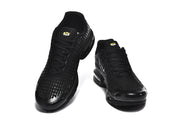 Top view of a pair of black Nike Air Max Plus VII sneakers