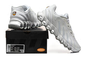 White Nike Air Max DN sneakers displayed with a shoe box; the box label shows sample size details.
