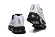 Rear and outsole views of white and black Nike Air Max Plus 3 sneakers