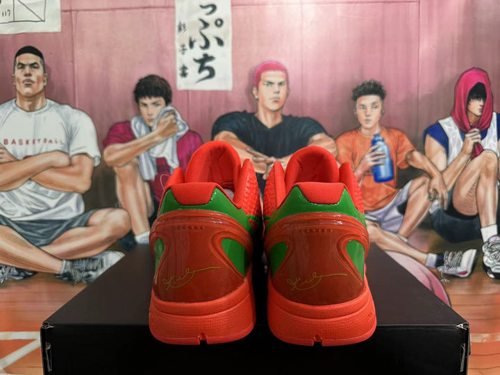 Rear view of red and green Nike Kobe PE basketball shoes