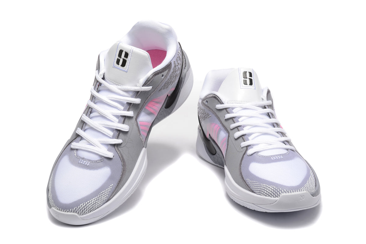 Pair of white and grey Nike basketball shoes with pink side accents, viewed from the front.