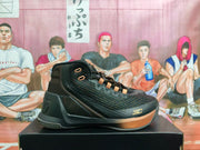 Side view of a black high-top basketball sneaker with brown eyelets, textured upper panels, a brown-accented midsole, and “SC” near the toe.