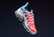 Angled view of the pink, blue, and white Nike Air VaporMax Plus sneaker