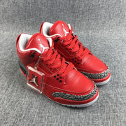 Close-up of the red toe area, laces, and elephant-print overlay.