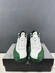 Front view of the pair showing white laces, green toe overlays, and purple details near the toes.