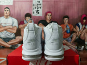 Rear view of white Nike sneakers showing embroidered Nike Air branding and transparent heel air units.