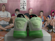 Rear view of the sneakers showing green heel panels and small embossed star details.