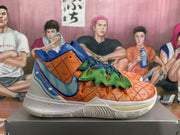 Side view of a basketball sneaker showing the Nike Swoosh, orange patterned upper, green overlay and speckled white midsole.