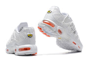 Rear and outsole views of white Nike Air Max Plus sneakers with orange accents and Tuned Air heel badges.