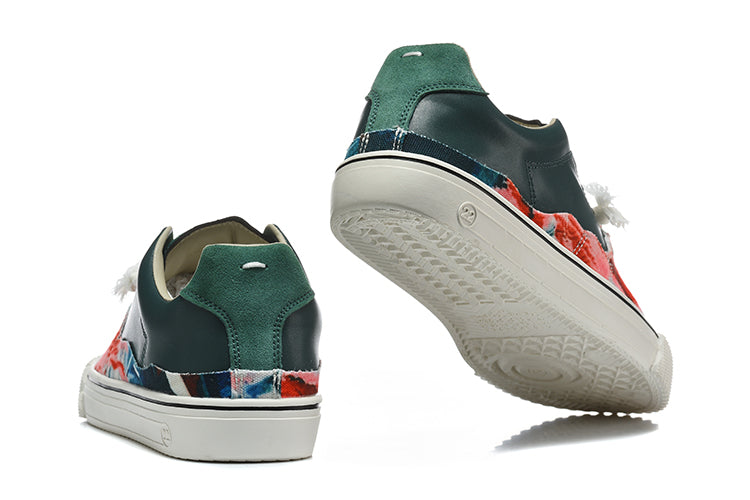 Rear and outsole views of dark green and multicolor split-toe low-top sneakers.