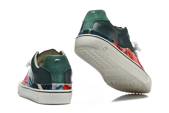 Rear and outsole views of dark green and multicolor split-toe low-top sneakers.