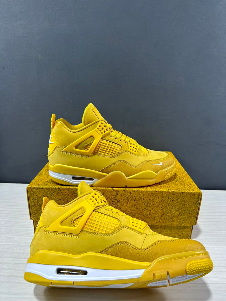 Pair of yellow Jordan Air Jordan 4 sneakers shown from the side on a matching textured shoebox.
